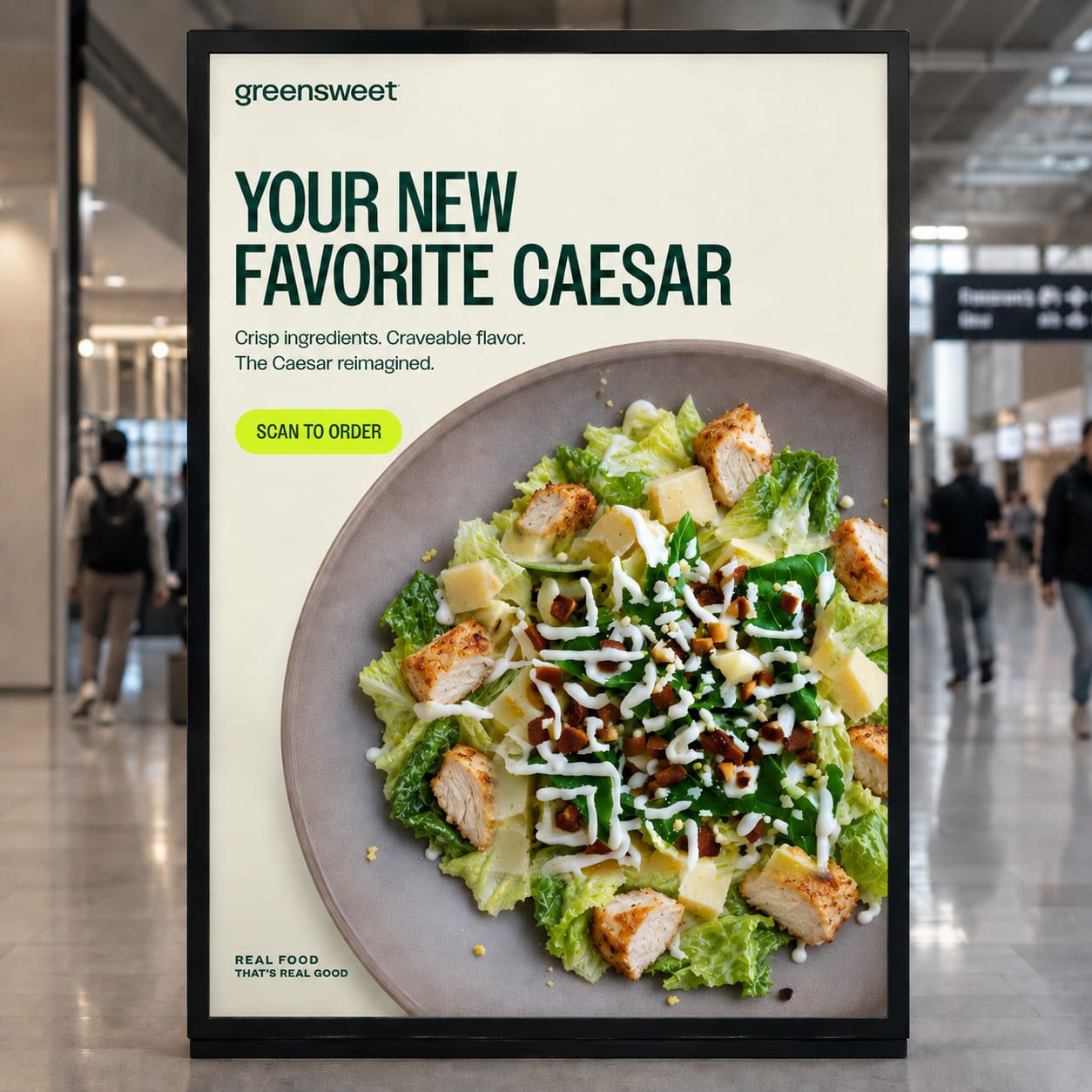 greensweet digital advertising screen standing in an airport terminal with travellers walking past. The headline reads “Your new favorite Caesar” above a bright green “Scan to order” button, and the Caesar salad on the plate is itself a StoryCode, its pattern formed from the chicken, parmesan, croutons and dressing.